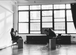 Coach taking photo of client during coaching session