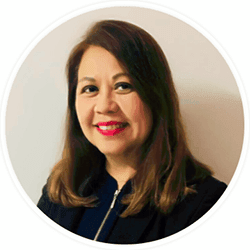 Jo Anne Ng Loo Yen PCC headshot photo, smiling dark haired woman wearing a dark top in front of a white wall