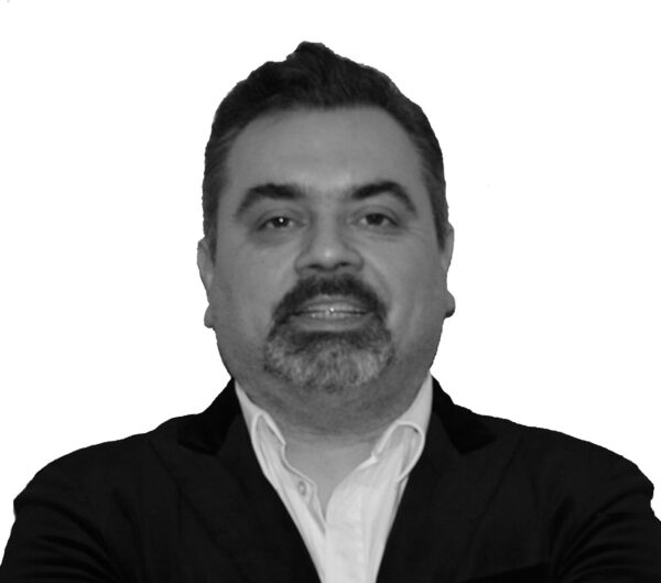 Dr Max DiGregorio PCC headshot photo, smiling man wearing black suit black and white photo