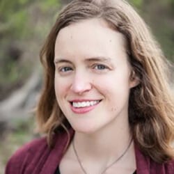 Sheersty Stanton headshot photo, smiling woman with blond hair wearing a red sweater outside