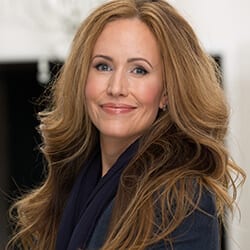 Stephanie Weichert PCC MBA CPT ACC headshot photo, smiling woman with light brown hair wearing a dark top