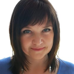 Dr. Tatiana Krawczynska PCC headshot photo, smiling woman with dark hair and blue top in front of white background