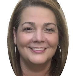 Cheryl Thacker PCC headshot photo, smiling woman with light brown hair and hoop earrings