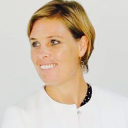 Elisabeth Van Loon-Muller ACC headshot photo, smiling woman with light brown hair wearing a white top