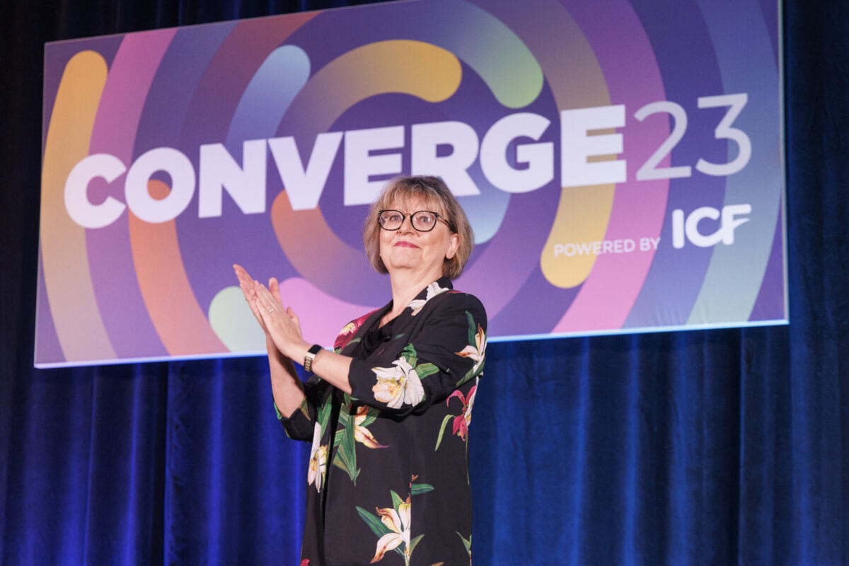 Main stage at the ICF Converge Conference with a keynote speaker addressing a global audience of coaches.