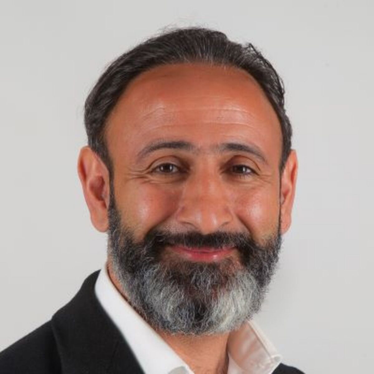 Headshot of Kaveh Mir-Tahmasebi, ACTC, MCC, Treasurer, and Global Professional Coaches Board Director with the International Coaching Federation. Known for fostering positive behavioral change and enhancing performance, engagement, and leadership transitions.