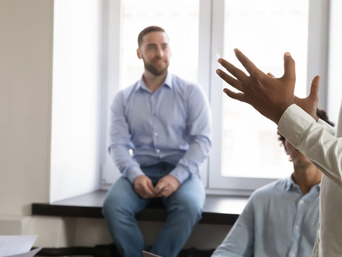 A man goes over the team coaching competencies with his team.