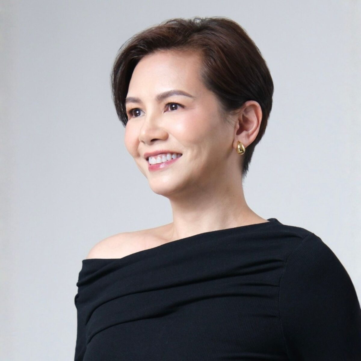 Headshot of Nikka + Santos + author with International Coaching Federation.