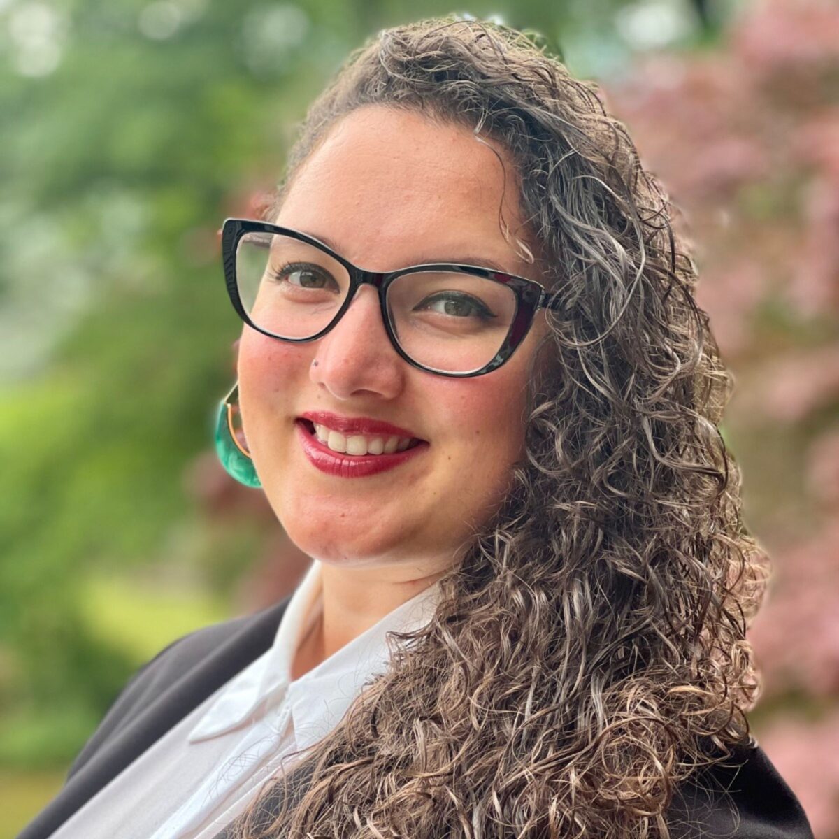 Headshot of Tiffany Garcia, Author with the International Coaching Federation. Known for her understanding in the obstacles coaches face.