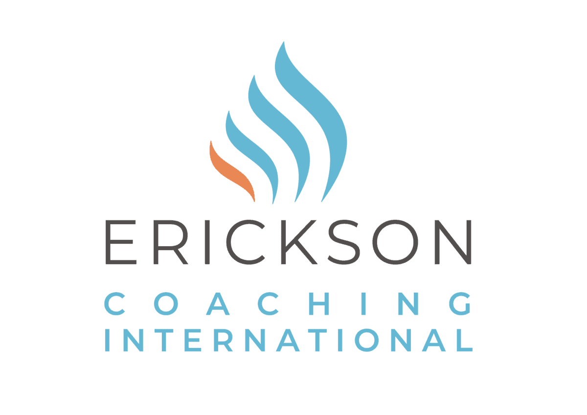 Erickson Coaching International logo featuring a stylized blue and orange flame above the words “Erickson Coaching International.”