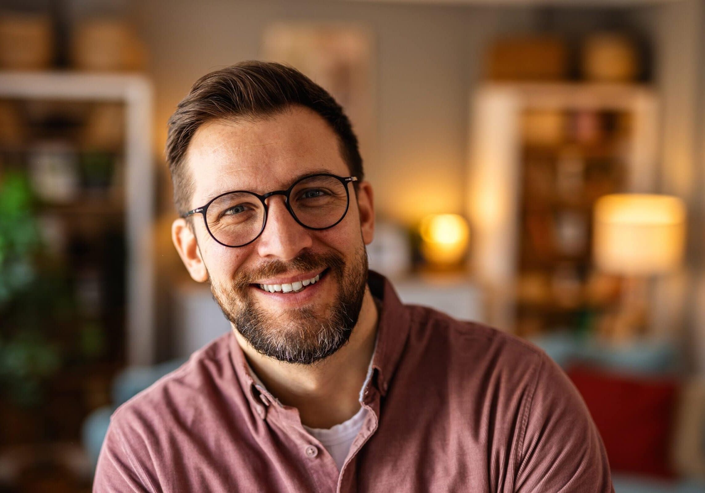 Smiling,Young,Man,With,Glasses,And,A,Beard,In,A