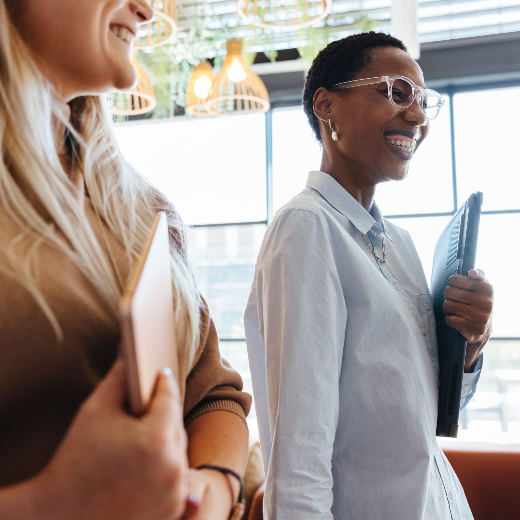 Two woman walking around a professional business together.
